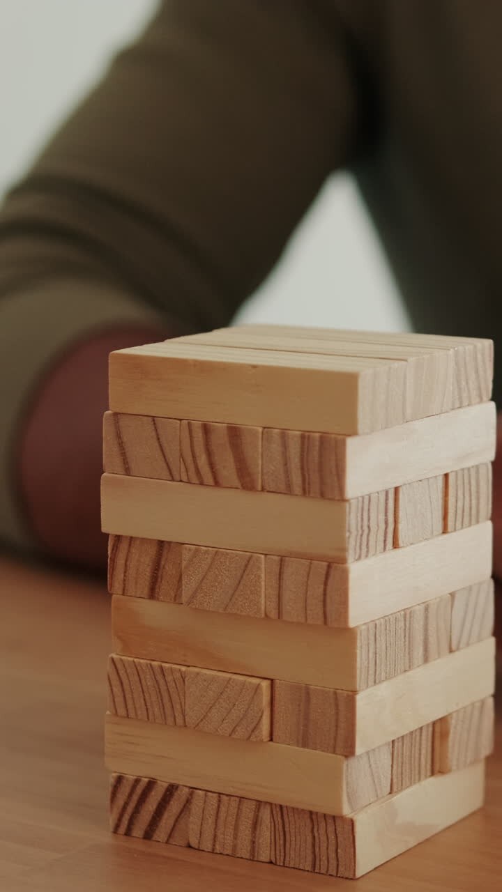 Couple Plays Jenga At Home
