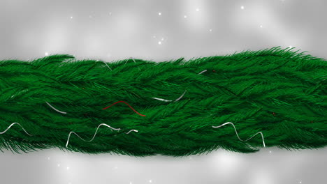 animation of fir tree branches with glowing lights on grey background