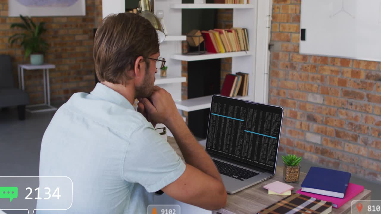 Mid adult man in tech office receiving notification bubble watching icons flooding then fading away