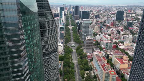 aerial panorama: the iconic paseo de la reforma with diana and angel monuments from afar