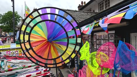 vibrant wind wheel spinning at a market stall