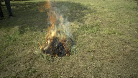 Slow-mo:-light-Bonfire-on-grass