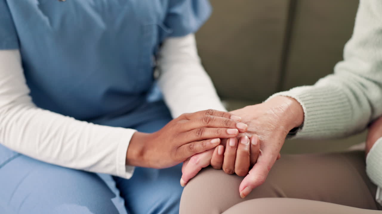 Nurse offering support to elderly patient