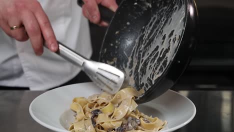 chef preparing mushroom pasta