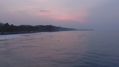 aerial drone view of la bocana surfers el tunco el salvador at sunrise