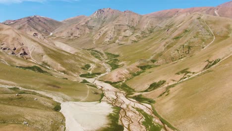 hiking area with arashan lake and scenic mountain views during summer in uzbekistan