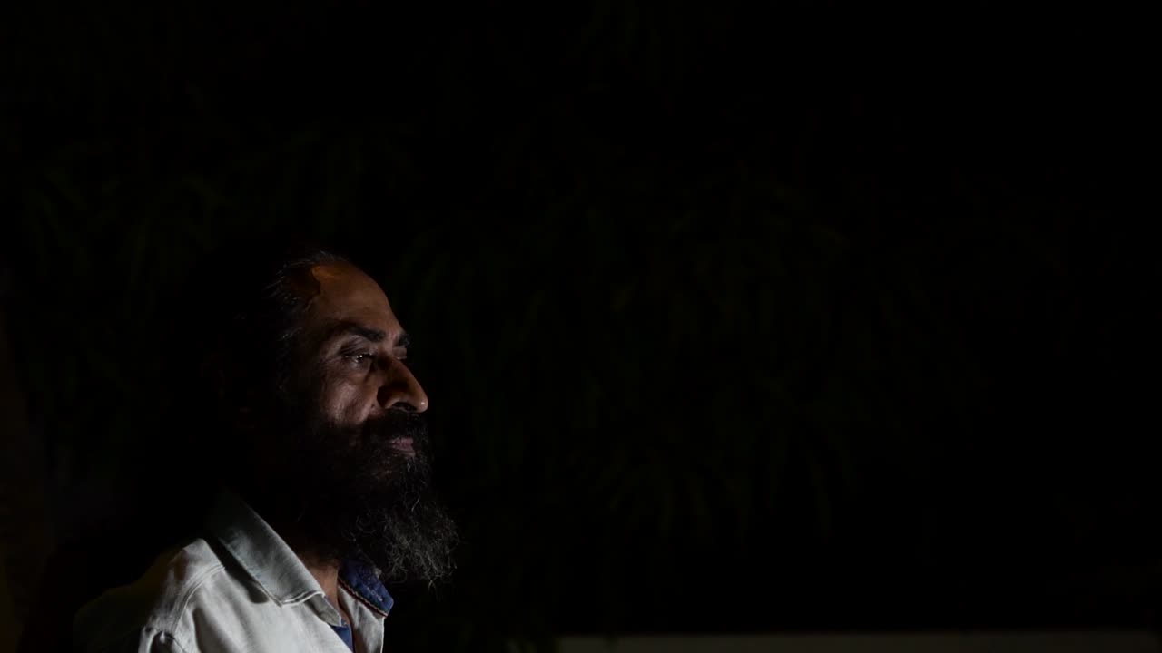 Young man in the dark looking hopeless