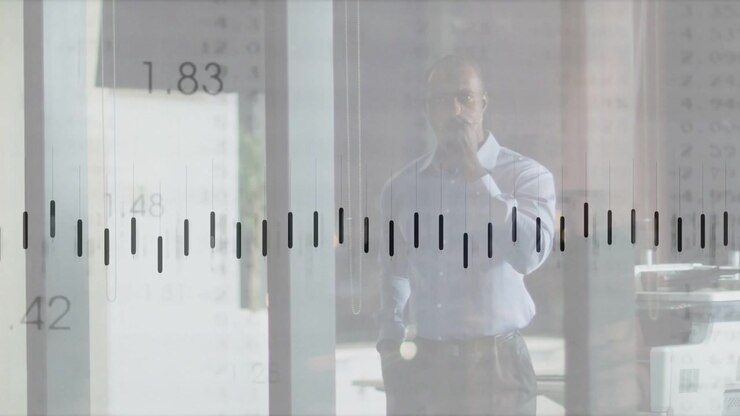 Vertical video: Exec talking on phone by glass, moving graph across frame causing gestures for data
