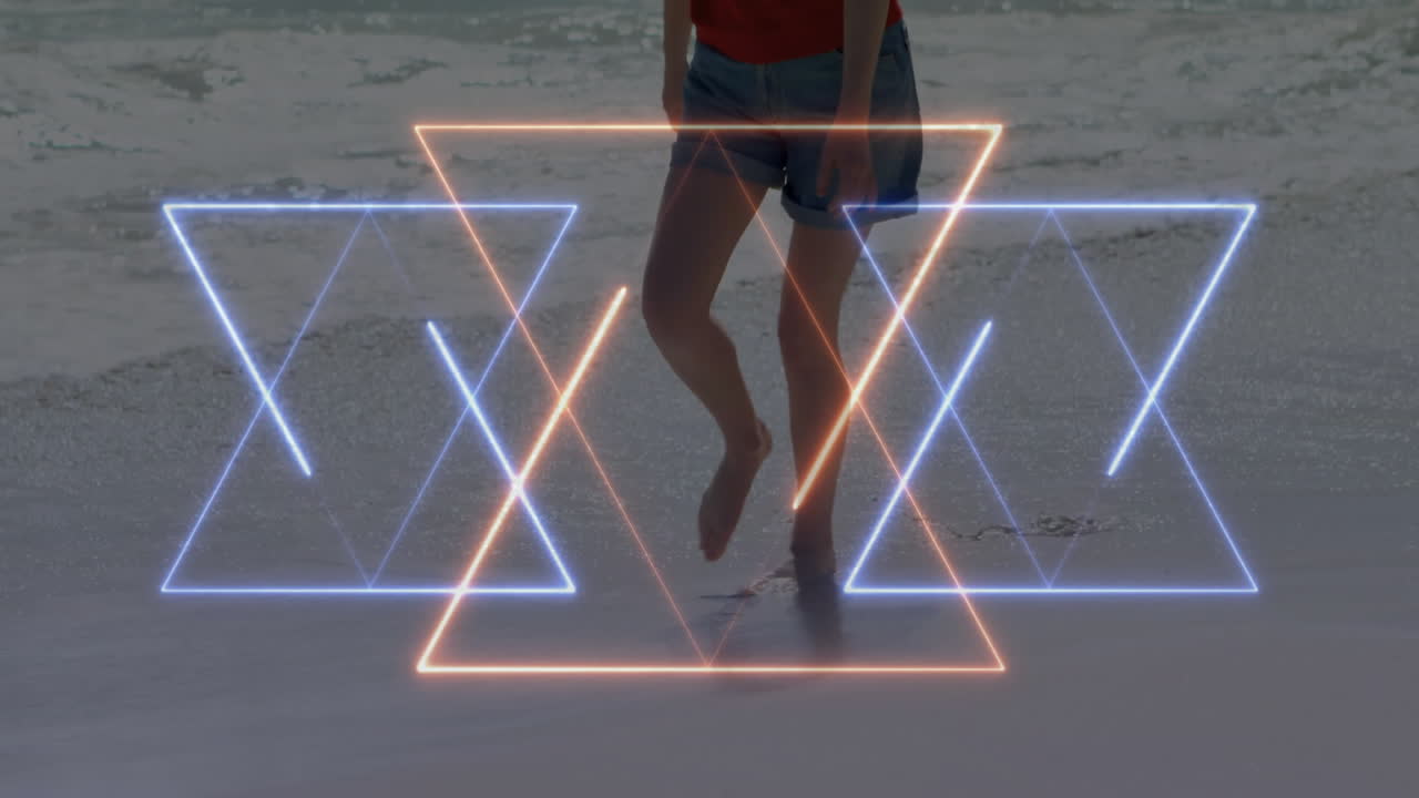 Person walking on beach with glowing geometric shapes animation overlay