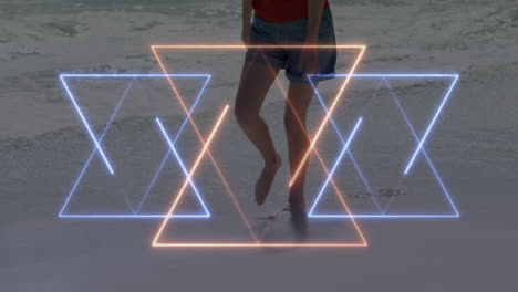person walking on beach with glowing geometric shapes animation overlay