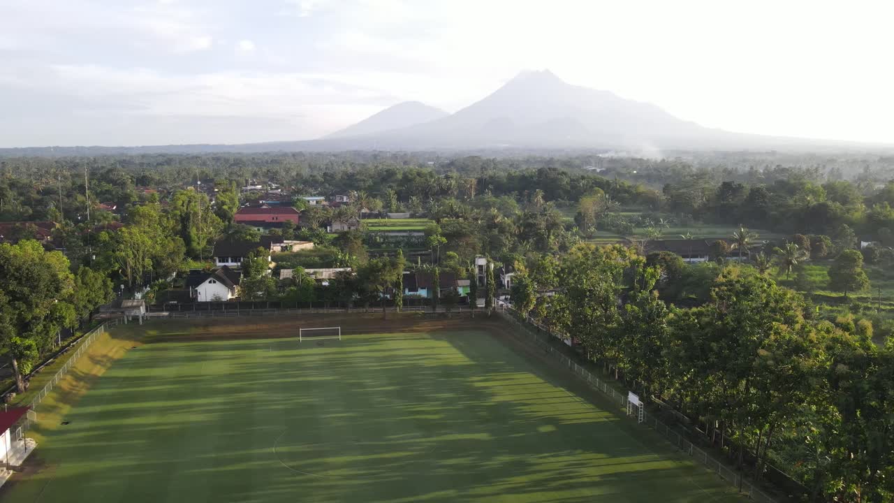 Aerial footage using drones. Purwobinangun Sports or soccer field in ...