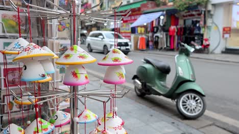 scooter parked near souvenir shop in hanoi