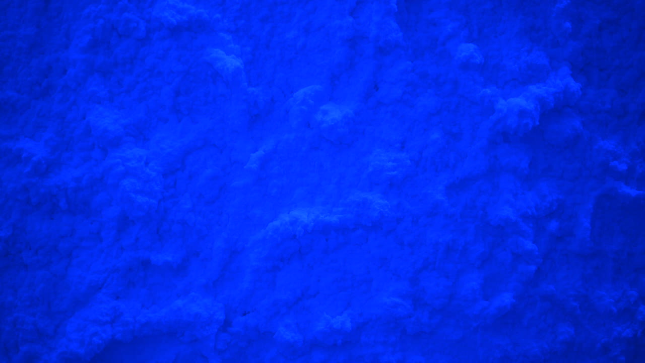 Close up of snow texture in blue light