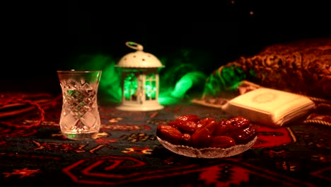 water and dates. iftar is the evening meal. slider view of decoration ramadan kareem holiday. festive greeting card, invitation for muslim holy month ramadan kareem. dark background. selective focus
