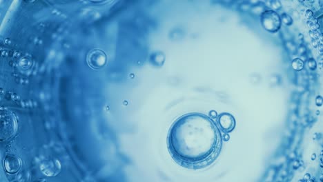 oxygen bubbles in water on a blue abstract background