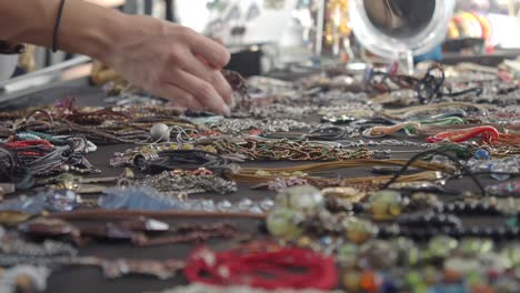 a vendor selling jewelry at a market