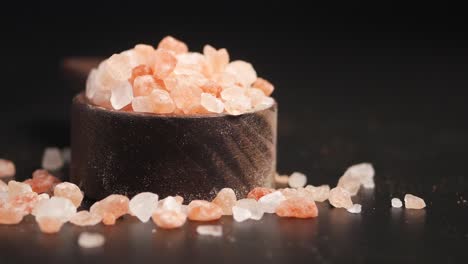 close-up of pink himalayan salt in wooden bowl