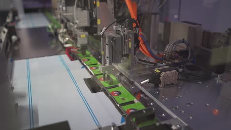 cards being printed with automatic machine in printing factory