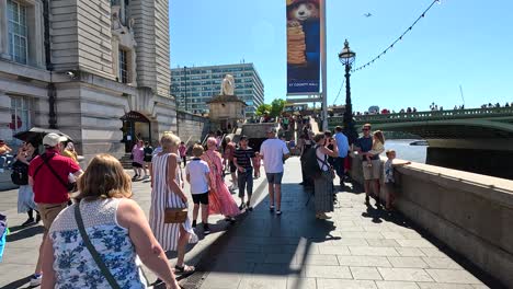 crowds enjoying a sunny day in london