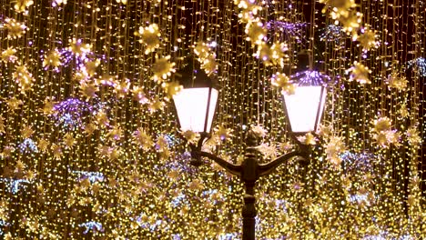 street lantern with decorative christmas garlands. new year and christmas celebration.