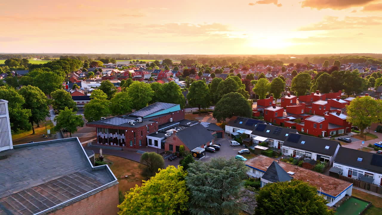 Beautiful green Overloon in the Netherlands. Vast panorama of the town at sunset from aerial perspective