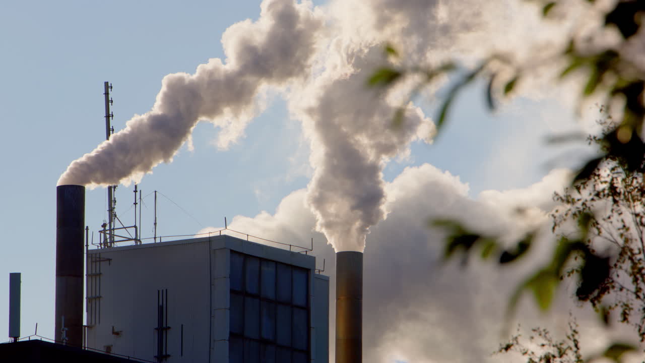 Factory Smokestacks Emitting Pollution into the Atmosphere