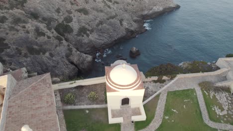 aerial view from above of a small sea inlet next to fortress of beliche sagres algarve portugal