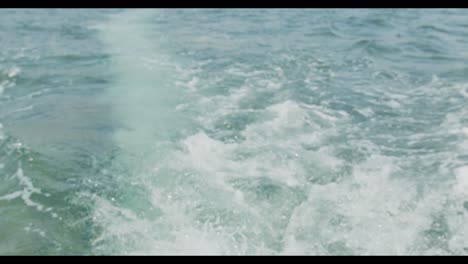 close-up-shot-of-the-water-behind-an-outboard-motor-on-a-boat