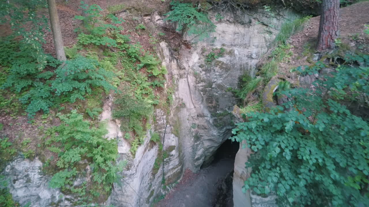 Devil's Oven or Large Ellite Natural Geological Monument  Located in the Gauja National Park at Lode Behind Cesis in Latvia. Licu – Langu Sandstone Cliffs Liepa Cave. Aerial Dron Shoot.