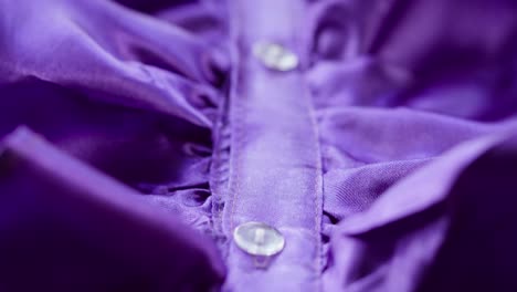 purple ruffles close-up. sewing a violet dress. handmade tailoring, professional clothing concept. abstract background