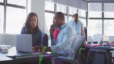 animation of graphs over multiracial coworkers discussing reports over laptop in office