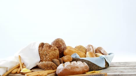 Various-bread-loaves-on-wooden-table