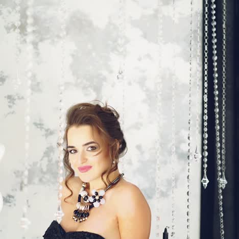 young woman standing in luxury room