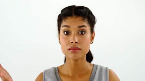 Woman-gesturing-while-talking-against-white-background-4k