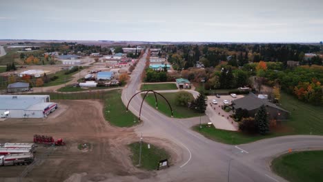 a wide angle long clip 4k drone shot of the northern canadian landscape a small rural town skiing fishing village main street arches in asessippi community in binscarth russell manitoba canada