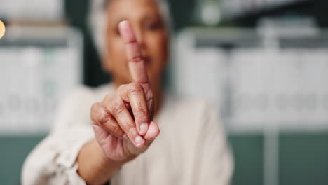 woman raising index finger