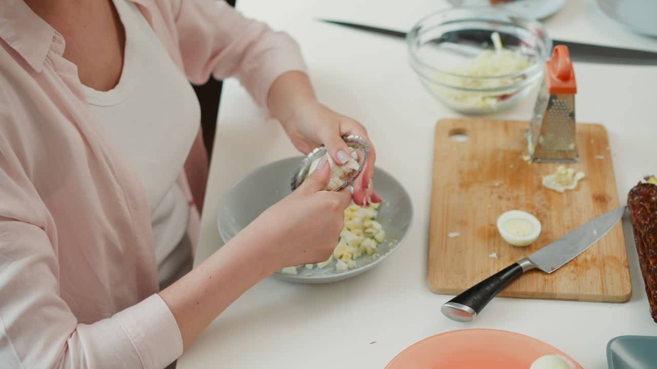 Woman preparing egg salad