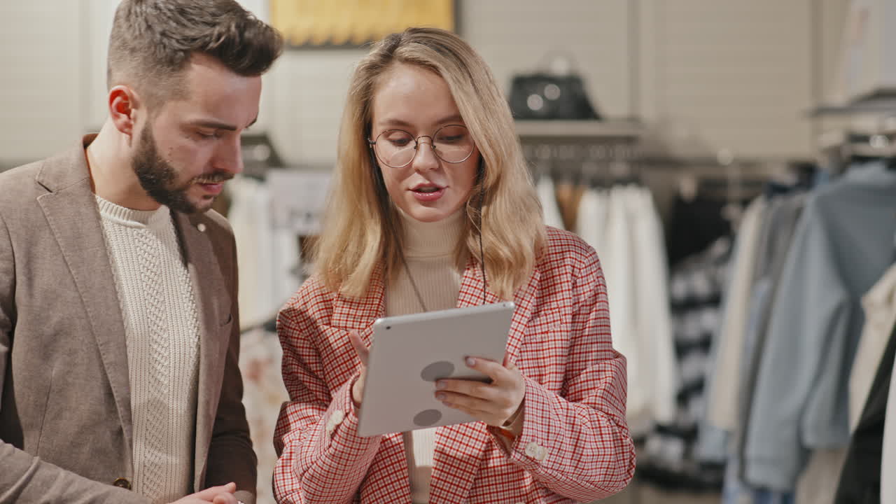 Man Shopping For Clothes With Fashion Stylist