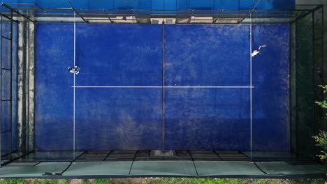 overhead view of a padel court with players