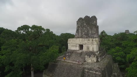 great aerial shot over the tikal pyramids in guatemala 5