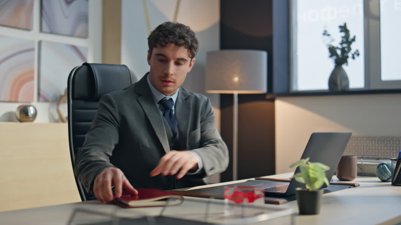 Office man starting day opening laptop lid in morning. Guy flipping notebook
