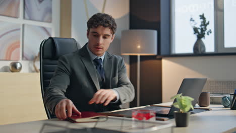 office man starting day opening laptop lid in morning. guy flipping notebook