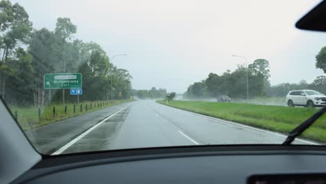 driving on a wet road during a rainy day