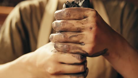 hands shaping clay