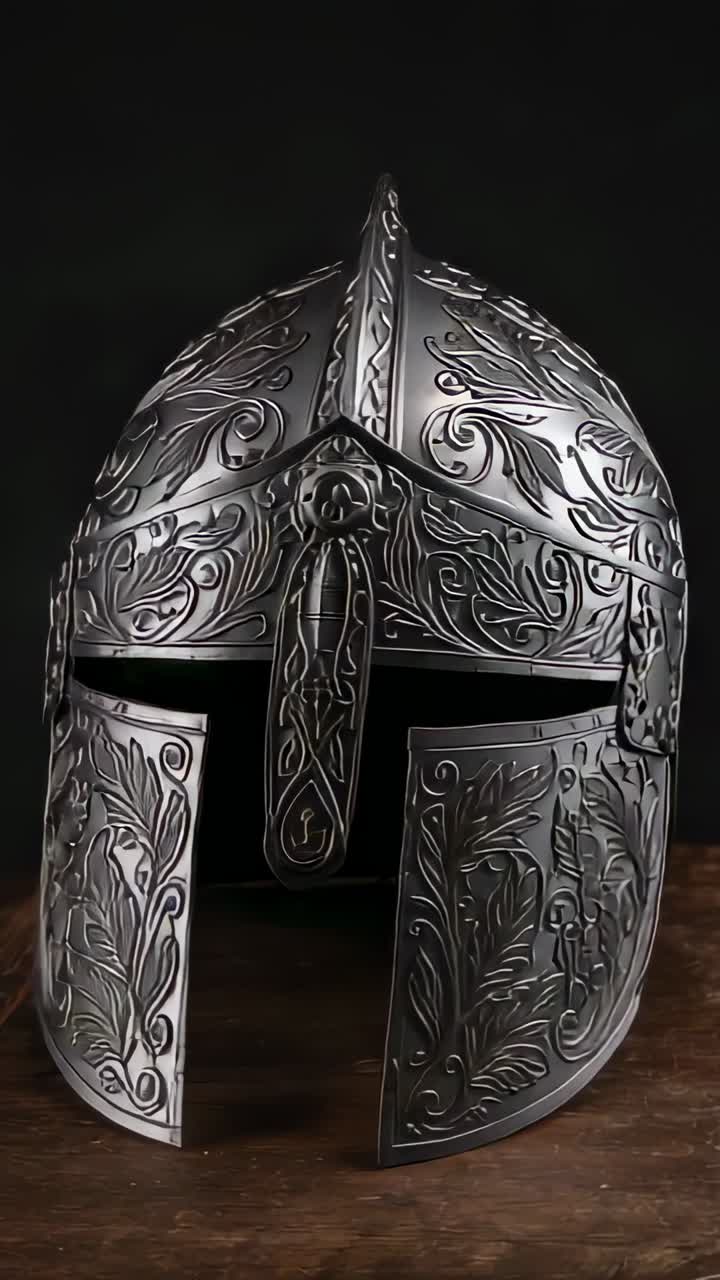 Vertical video: Rotating steel helmet on motorized base showcasing floral leaf patterns on table