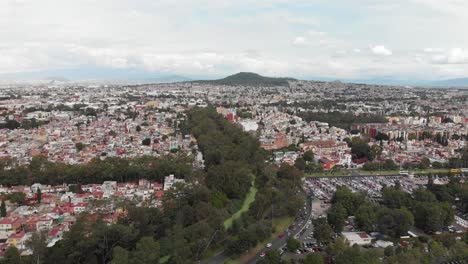 Drone-view-of-"Cerro-de-la-Estrella"-and-"Canal-Nacional"-in-southern-Mexico-City,-CDMX