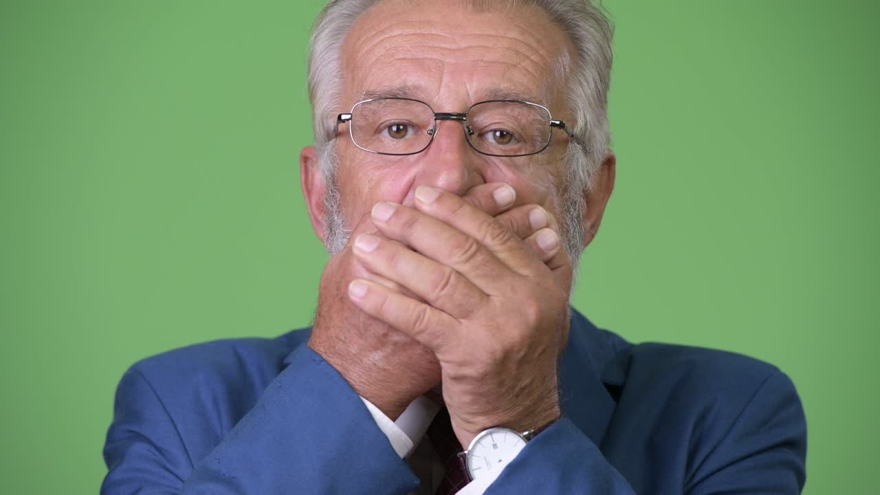 초록색 배경 에 있는 잘생긴 수염 이 있는 상인