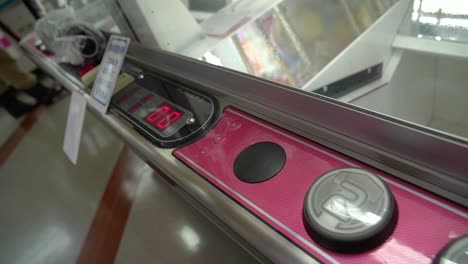 close-up-shot-of-crane-claw-game-controls-at-an-arcade-game-center-in-Japan