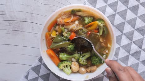 vegetable soup in a bow on table , top view