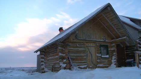 a log cabin in the snow